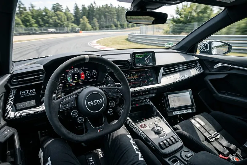 Engineer checking a test vehicle cockpit during validation